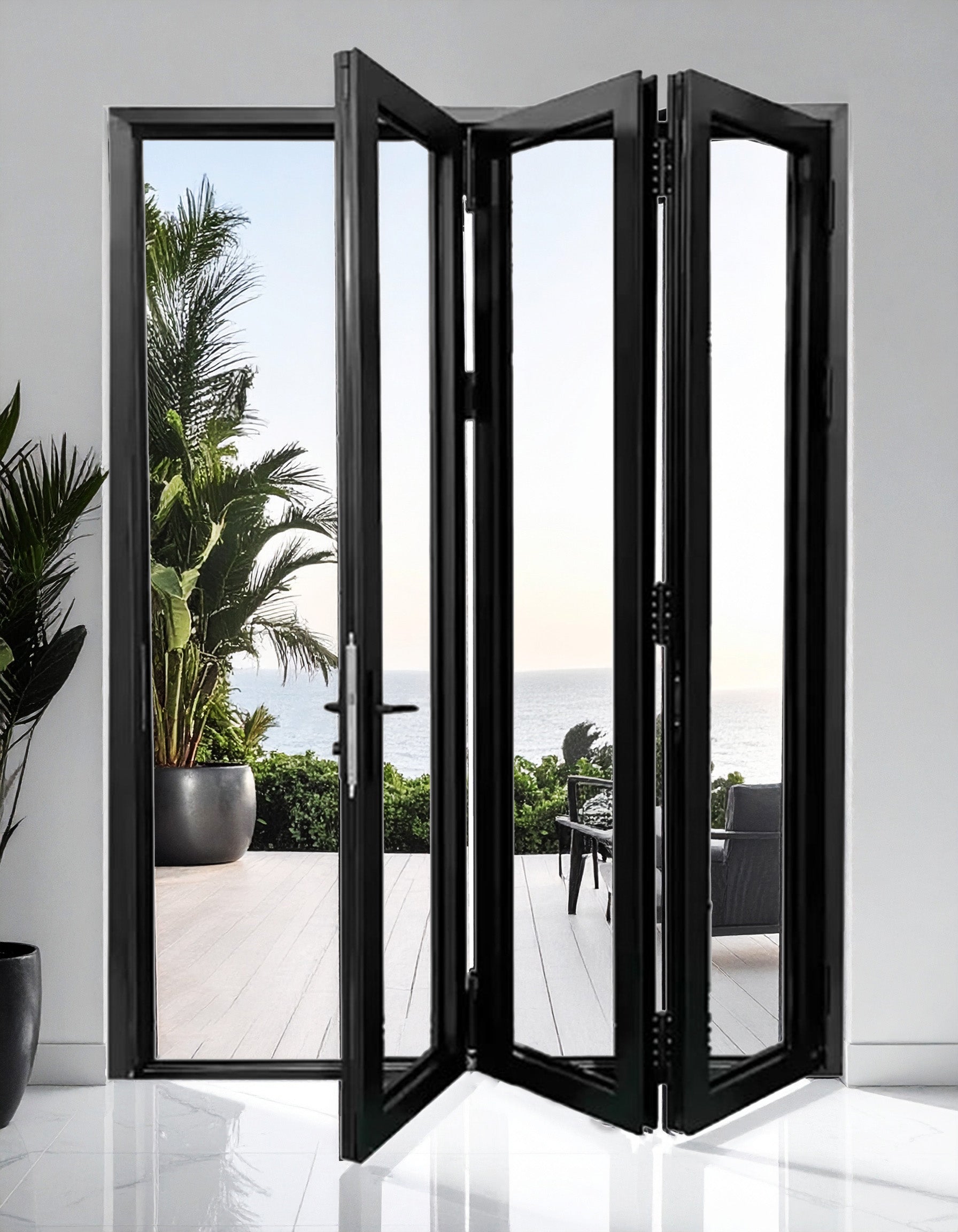 Black folding door with a view of a patio and ocean